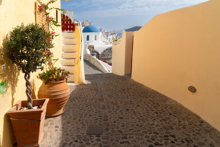street and wooden gates against volcano caldera, beautiful details of Santorini island, Greeceの写真素材