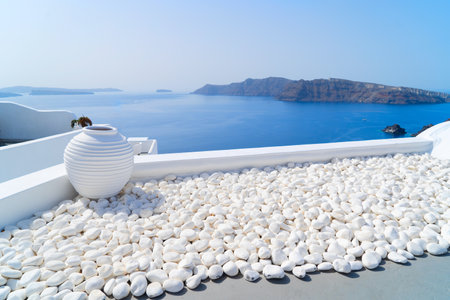 white pebbles against volcano caldera, beautiful details of Santorini island, Greece, retro tonedの写真素材