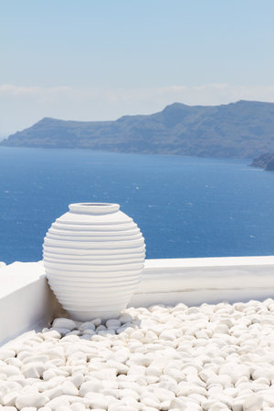 white greek amfora against volcano caldera, beautiful details of Santorini island, Greeceの写真素材