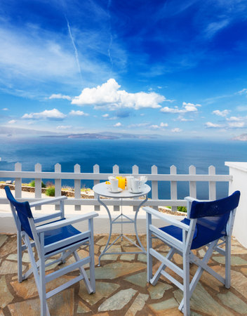 fresh greek breakfast at morning by seaside with caldera view, Santorini, Greeceの写真素材