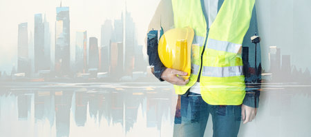 ingineer on construction site, architector with helmet, cityscape in background
