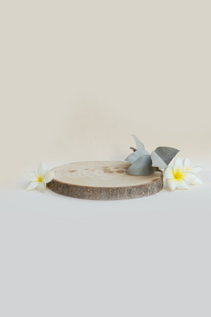 Minimal modern product display podium on neutral background with wooden podium, tropical summer flowersの写真素材