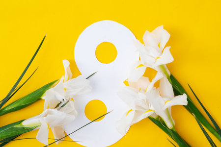 Irise yellow flowers on tender yellow spring background, 8 march day festive background, mimose is traditional flowers for international women day 8 of marchの写真素材