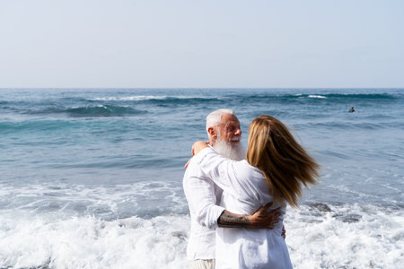 lifestyle with caucasian senior couple dance on beach, happy in love romantic and relax time, tourism of elderly family pleople, leisure and activity travel after retirement in vacations and summerの写真素材
