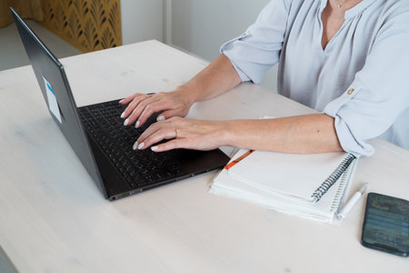 Senior woman working with modern laptop, technology and elderly lifestyle people conceptの写真素材