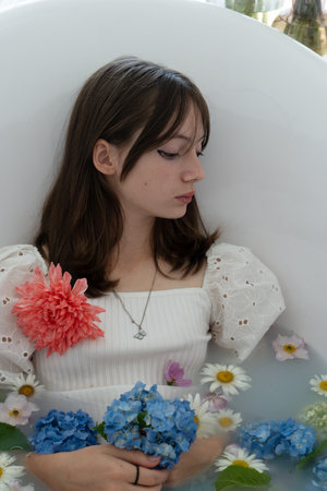 Teenage girl with flowers, spring conceptの写真素材