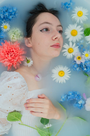 Teenage girl with flowers, spring conceptの写真素材
