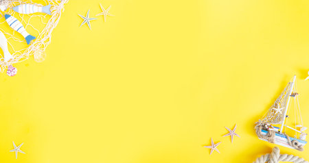 Summer flat lay scenery with fishing boat on yellow background banner with copy spaceの写真素材