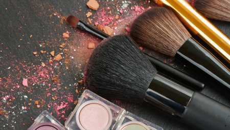 set of brushes, eye shadows and maskara on black backgroundの写真素材
