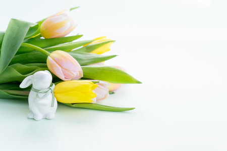 Easter scene with with tulips and bunny, copy spaceの写真素材