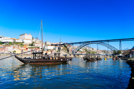 Picturesque, colorful view at old town Porto with bridge, Portugal with bridge Ponte Dom Luis over Douro river. Oporto, touristic mediterranean cityの写真素材