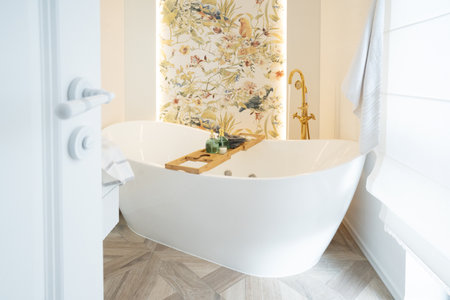 White bathroom with big window and big freestanding bathtubeの写真素材