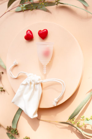 Menstrual cup over violet background, eco friendly and zero waste solutionの写真素材