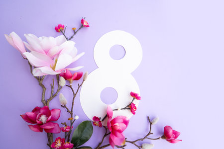 Magnolia flowers on green spring background, 8 march day festive background, flowers for...