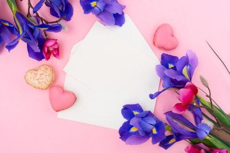 Mothers day background with flowers and cookies, frame with copy spaceの写真素材