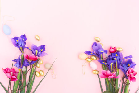 Easter scene with colored eggs in nest with irises, copy spaceの写真素材
