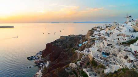 sunset over Oia village, Santorini island, Greece, pamorama with Aegan seaの写真素材