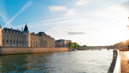 La Consiergerie - ex royal residence, bridge Pont Neuf and Seine river at sunny summer sunset, Paris, Franceの写真素材