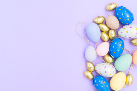 Easter scene with colored eggs and rabbits earsの写真素材