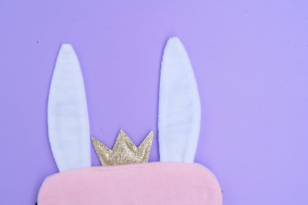 Easter scene with rabbits ears over violet backgroundの写真素材