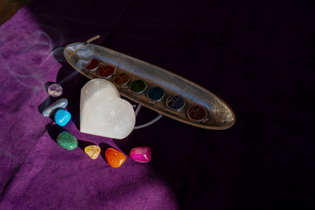 seven chakras signs and stone heart with flower of life patternの写真素材
