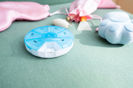 pill box with sleeping mask and pill box, sleep-wake disorders concept, insomnia therapy, sleep difficulties and deprivationの写真素材