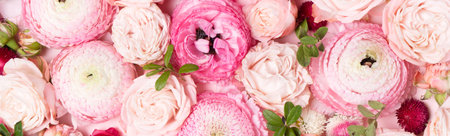 Flowers composition. Floral texture made of roses and ranunculus flowers on pink background. Flat lay, top viewの写真素材