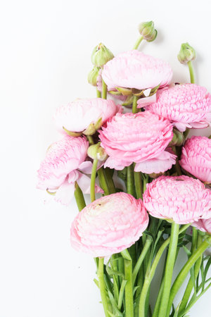 Bouquet of ranunculus flowers on white background. Flat lay, top view scene.の写真素材