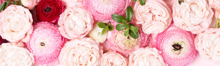 Flowers composition. Floral texture made of roses and ranunculus flowers on pink background. Flat lay, top viewの写真素材
