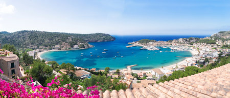 view of Port Soller harbour with house roofs, Mallorca at summer, wide panoramaの写真素材