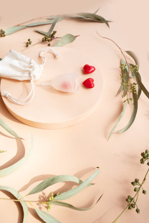 Menstrual cup over violet background, eco friendly and zero waste solutionの写真素材