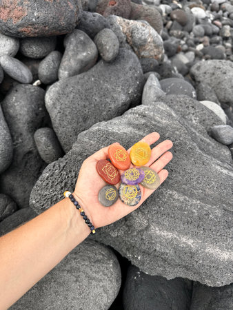 Hand holding chakra healing crystals. Witchcraft, herbal medicine and healing, Magic healing Rock for Reiki Crystal Ritual, Witchcraft, spiritual esoteric practiceの写真素材