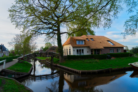 rural dutch traditional country small old town Giethoorn with canals, Netherlands sceneryの写真素材