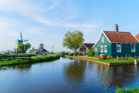 rural dutch country skyline of small old town Zaanse Schans with windmills, Netherlandsの写真素材