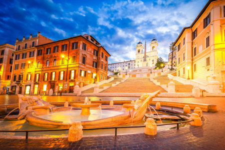Spanish Steps with flowing boat fountain illuminated at night, Rome, Italyの写真素材
