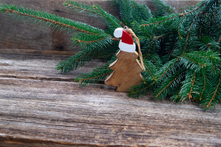 Christmas scene with Christmas tree on rusric wooden backgroundの写真素材