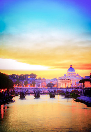 St. Peter's cathedral over bridge and river in Rome at orange sunset, Italy, retro tonedの写真素材