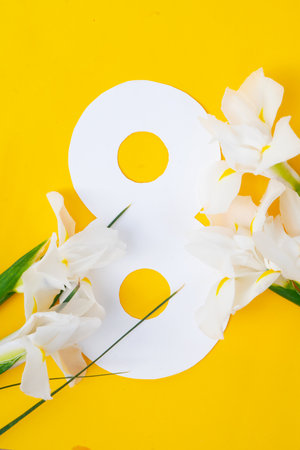 Irise yellow flowers on tender yellow spring background, 8 march day festive background, mimose is traditional flowers for international women day 8 of marchの写真素材