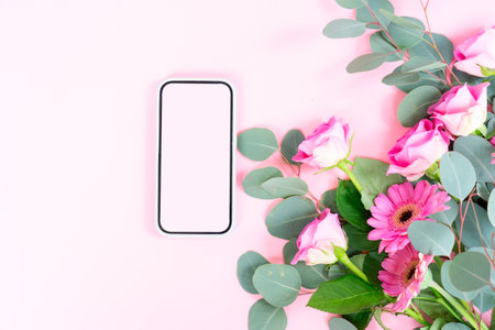 wedding or mothers day background, bouquet of roses and herberas with fresh eucaliptus leaves over plain pink background, copy spaceの写真素材