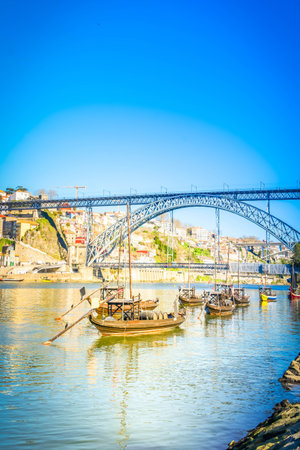 Picturesque, colorful view at old town Porto with bridge, Portugal with bridge Ponte Dom Luis over Douro river. Tourist cityの写真素材