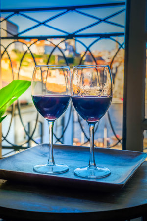 Two glasses with purple wineの写真素材