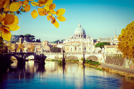 St. Peters cathedral over bridge and Tiber river in Rome at fall day, Italyの写真素材