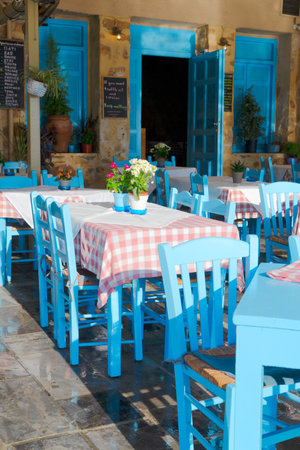 cafe in venetian habour of Chania with historical houses at sunny day, Crete, Greeceの写真素材