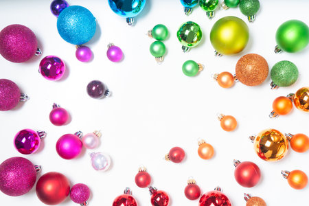 Colorful christmas lifestyle - frame of multicolored rainbow christmas decorations, top viewの写真素材