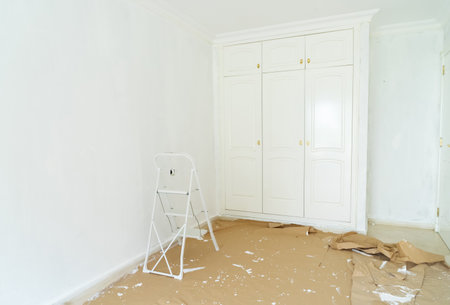 home renovation concept - old apartment during restoration or refurbishment with white plaster wallsの写真素材