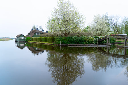 rural dutch traditional country small old town Giethoorn with canals, Netherlands sceneryの写真素材