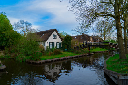 rural dutch traditional country small old town Giethoorn with canals and bridge, Netherlands sceneryの写真素材