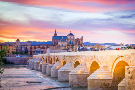 old cathedral (Mezquita)and roman bridge at twilight, Cordoba, Andalusia, Spainの写真素材
