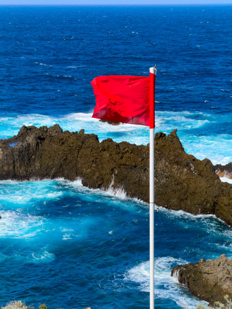 north coast of Tenerife island, red flag banning swimming at Charco del Viento natural pools,...