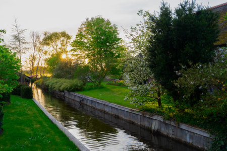 rural dutch traditional country small old town Giethoorn with canals, Netherlands sceneryの写真素材
